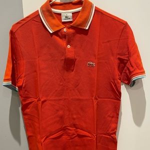 Lacoste polo shirt. For BOYS. Orange color. Size: 14. slightly used.